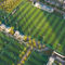 Hierba artificial del césped sintético de la hierba de putting green del paisaje del fútbol